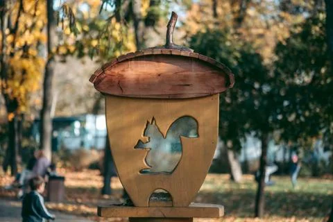 Squirrel feeder in the form of a tree nut in a park Stock Photos