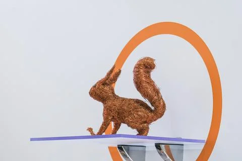 Squirrel figurine made of copper wire on display at a cable industry exhibition. Stock Photos
