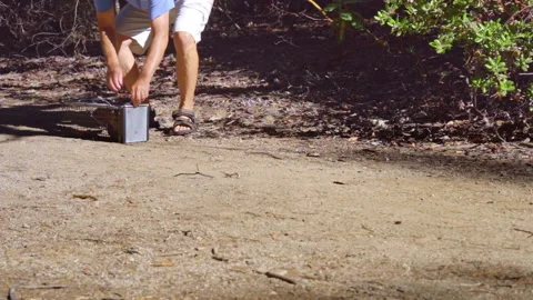 Squirrel Runs to Freedom After Release From Trap Stock Footage 140154835