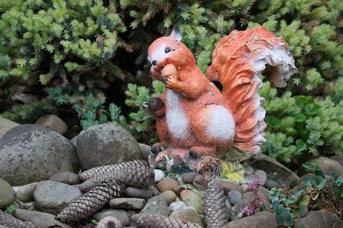 Squirrel statue in garden Stock Photos