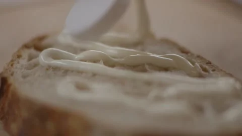 Squirting mayo onto slice of bread Stock Footage 194478424
