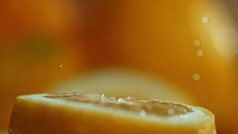 Squizzing Lemon by Hand SLow Motion Macro Close Up Stock-Footage 153213657