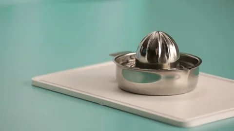 Squizzing lemons for lemonade 2 Stock Footage 132149715