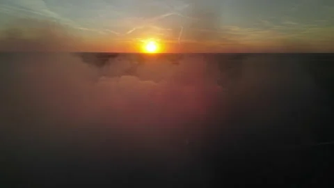 Sramatic scene of black smoke and sun at sunset Stock Footage 345447150