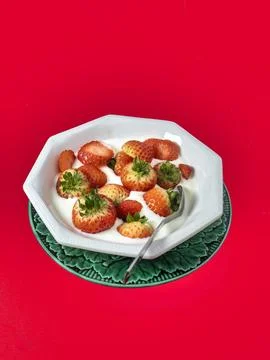 Srawberries on red Stock Photos