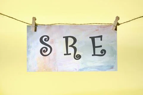 SRE. Site Reliability Engineering acronym concept on cubes and diagrams on a  Stock Photos