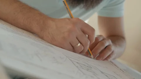 Сreative process. Designer at work make a blueprint. Men's hands draw. Stock Footage 120685758