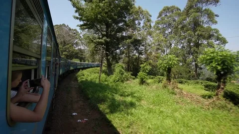 SRI LANKA - CIRCA 2017: Prospect view of the train with tourists traveling Stock Footage 76776074