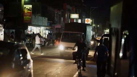 SRI LANKA - GALE, CIRCA2017: Camera moves through the night traffic small asian Stock Footage 77280553