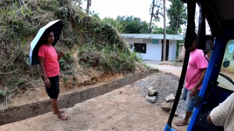Sri Lankan builder waves on the road in Kandy, HD. Stock Footage 140247058