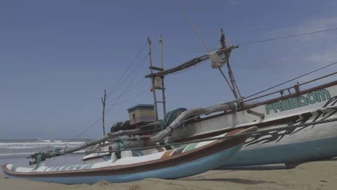 Sri lankan fishing boat on the sand Stock Footage
