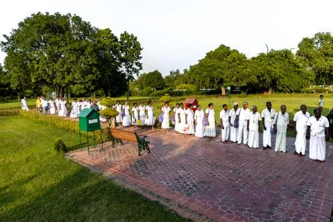 Srilankan devotees standing in queue to observe the birth place of Buddha at  Stock Photos