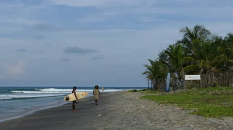 Srilankan guys looking at a surfboard Stock Footage 62863738