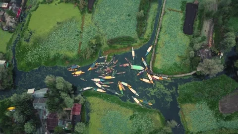 Srinagar, India-August 15 2025- Drone flying above bustling boat market activity Stock Footage 310786170