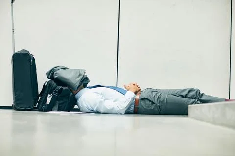 Ssh, they wont know Im taking a nap. an unrecognizable businessman sleeping in Stock Photos