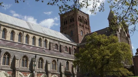 St Albans Abbey in Spring, with wind blown tree 스톡 동영상 62651693