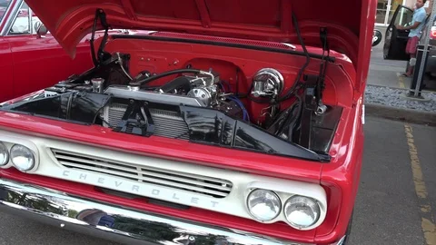 St. Albert Albert Canada - August 2017: Pan of car hoods at outdoor car show Stock Footage 114946862