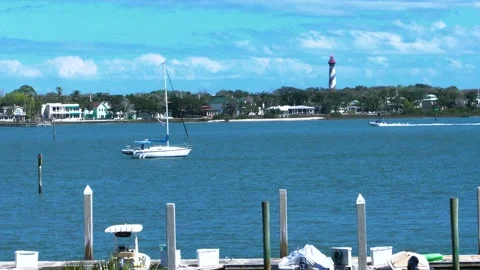 ST Augustine Docks With Lighthouse and Boasts Driving By Stock Footage 171982898