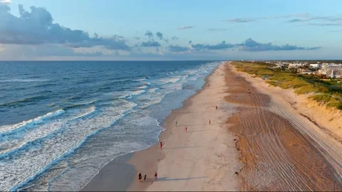 St Augustine FL Beach Flying South over Beach coast then to sun Stock Footage 248392874