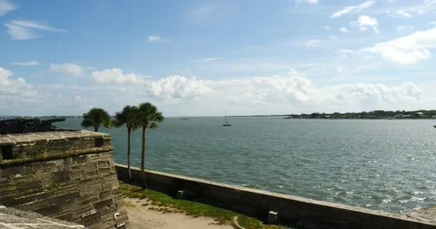 St Augustine Florida Bay Waters blue skies in front of old Fort made of stone Stock Footage 210298543