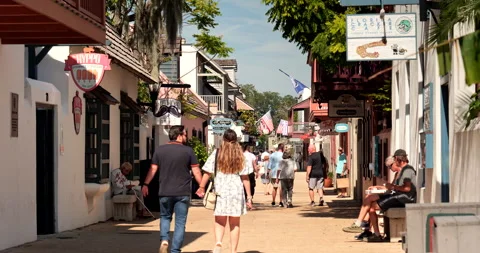 St. Augustine Florida people walk along Saint George street in the historic Stock Footage 249358254