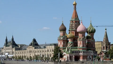 St. Basil's Cathedral against blue sky. Building of state department store Stock Footage 114160810