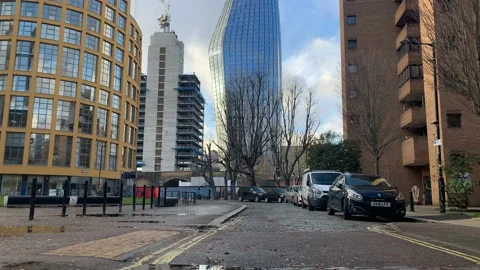 St. george One Blackfriars building reflected in a puddle on a winter day Stock Footage 145400317