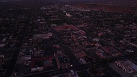 St. George, UT, USA - March 28 2026: Aerial tilt up from city streets to the LDS Stock Footage 333920001
