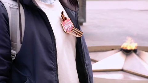 St. George's ribbon on the chest on the jacket in honor of Victory Day on May 9. Stock Footage 278480607