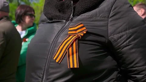 St. George's ribbon on the chest on the jacket in honor of Victory Day on May 9. Stock Footage 278481474