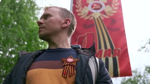 St. George's ribbon on the chest on the jacket in honor of Victory Day on May 9. Stock Footage 278481521