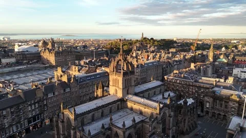 St Giles' Cathedral full circle drone flight in Edinburgh Scotland at sunset Stock Footage 287637817