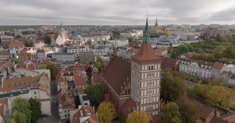 St. James Co-Cathedral tower above Olsztyn old town in autumn Stock Footage 346645221