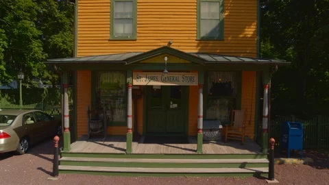 St James Historical General Store Backwards Aerial Pan Zoom Out 스톡 동영상 117440925