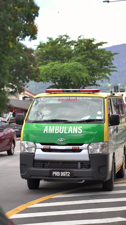 St John Ambulance Driving Through Streets of Penang Stock Footage 332268880