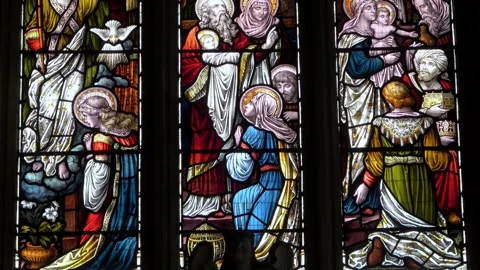 St John the Baptist Axbridge Stained Glass in The Lady Chapel tilt upwards Stock Footage 273963981