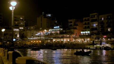 St Julian's Spinola bay in Malta, floodlit at night Stock Footage 106915677