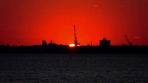 St Kilda Beach Sunset. Red Light.  People Passing on front of Camera Stock Footage 69744146