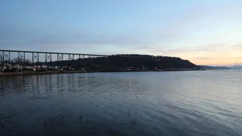 The St. Lawrence river, the 1908 railway trestle bridge and the Cap-Rouge bay Stock Footage 255788314
