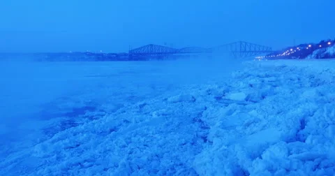 St. Lawrence river with Quebec Bridge at dawn winter Stock Footage 61297642
