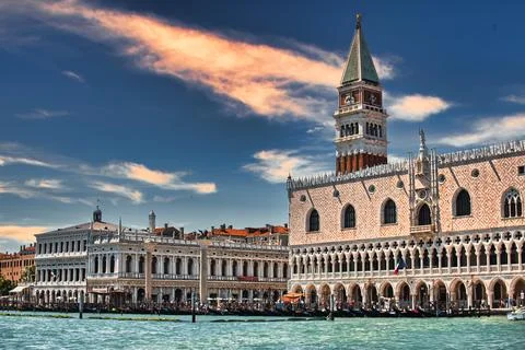 St Mark's Square bell tower at sunset with the Grand Canal empty during the covi 库存照片