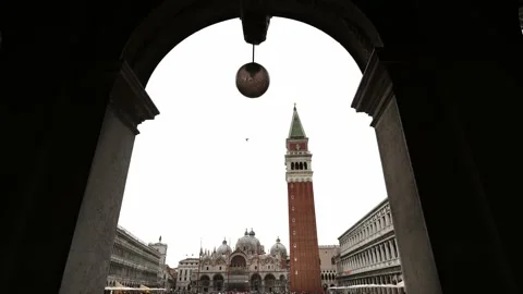 St Mark's Square, seen thru the arches. Piazza San Marco, St. Mark’s Basilica.  Stock Footage 222469606