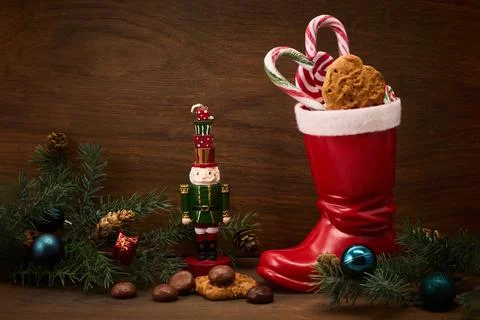 St. Nicholas Day. Red boot with sweets, spicy ginger cookies and gifts for Stock Photos