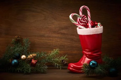 St. Nicholas Day. Red boot with sweets, spicy ginger cookies and gifts for Stock Photos