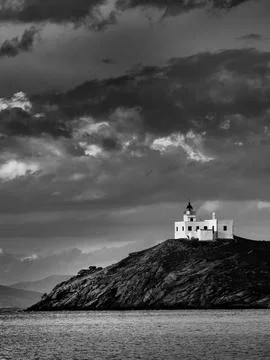 St Nicholas Lighthouse Under Storm Clouds Vertical Black and White Skyscape and Stock Photos