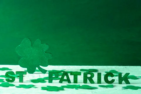 St Patrick words and green shamrock Stock Photos
