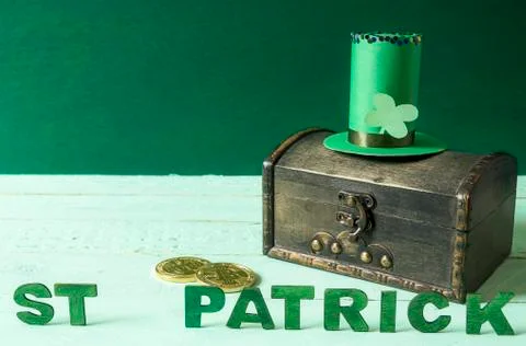 St Patrick words and hat on a treasure chest Stock Photos