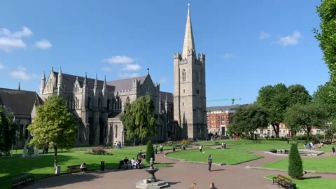 St Patrick's Cathedral and park. People are walking around. Dublin, Ireland Stock Footage 247549331