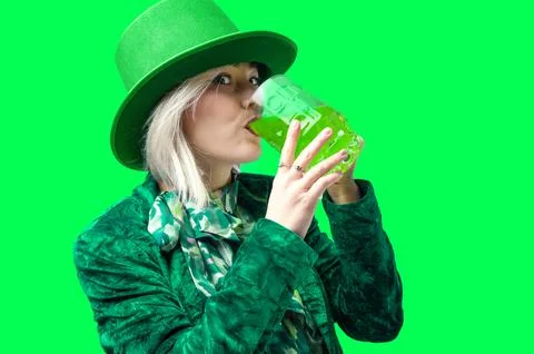 St. Patrick's Day celebration. Beautiful smiling woman wearing green hat wi.. Stock Photos