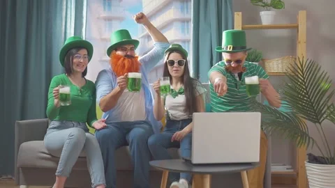St. Patrick's day a group of friends at home on the couch Stock Footage 149477422